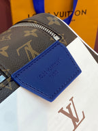 Louis Vuitton monogram belt bag corner with blue leather tag on the side