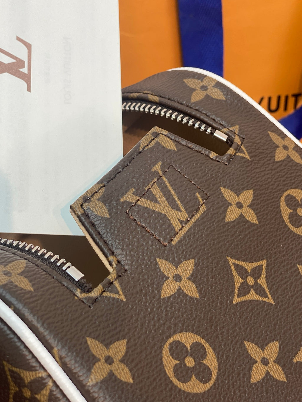 Louis Vuitton monogram bag corner with zipper detail