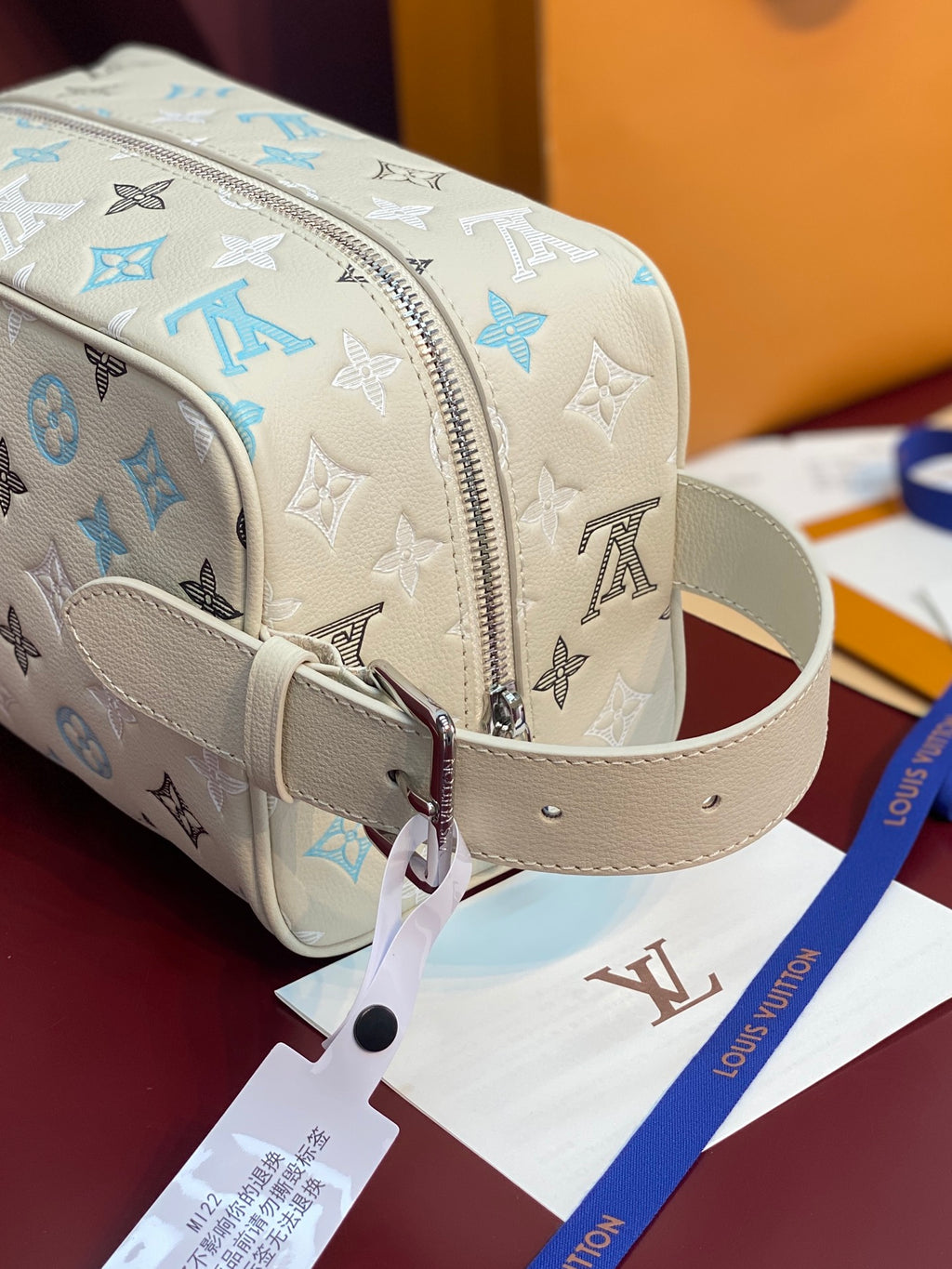 Louis Vuitton toiletry bag with detachable light beige strap and metal zipper pull