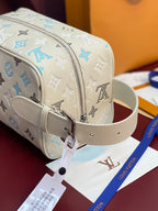 Louis Vuitton toiletry bag with detachable light beige strap and metal zipper pull