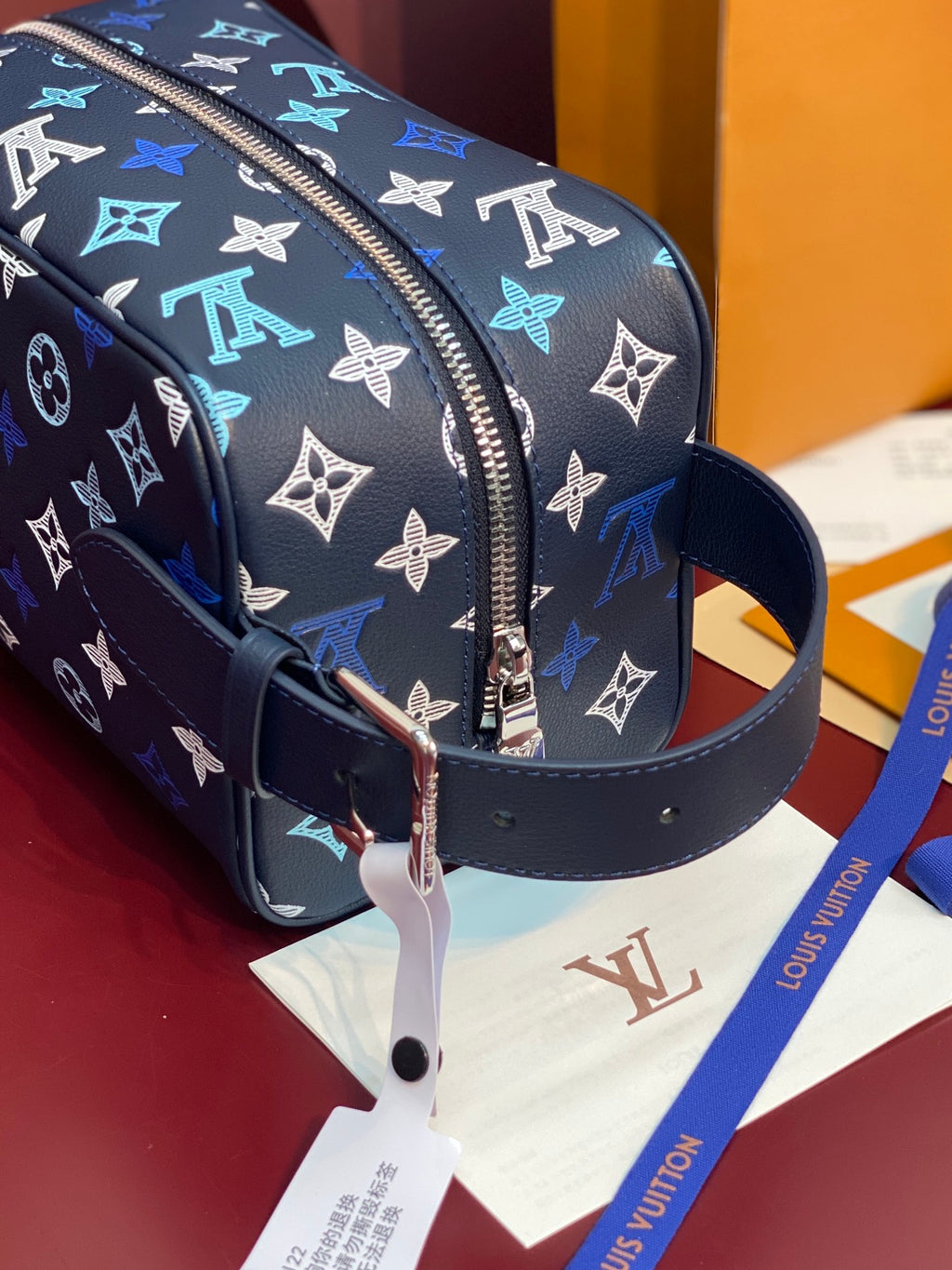 Louis Vuitton multi-color monogram bag with navy strap and silver-tone D-ring hardware