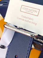 Louis Vuitton coated fabric cowhide leather lining tag with metal clasp on bag