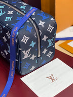 Louis Vuitton multi-color monogram bag end view with silver-tone top zipper