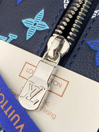 Louis Vuitton zipper pull and hardware detail over branded fabric lining tag