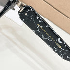 Black cat-eye glasses temple close-up with BVLGARI and MADE IN ITALY text