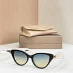 Black cat-eye glasses with light blue lenses and glossy frame