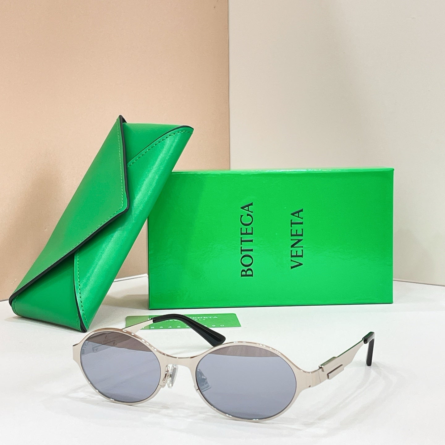 Bottega Veneta round sunglasses with silver-tone frame and gray lenses