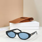 Celine sunglasses with black frames and blue tinted lenses, side view.