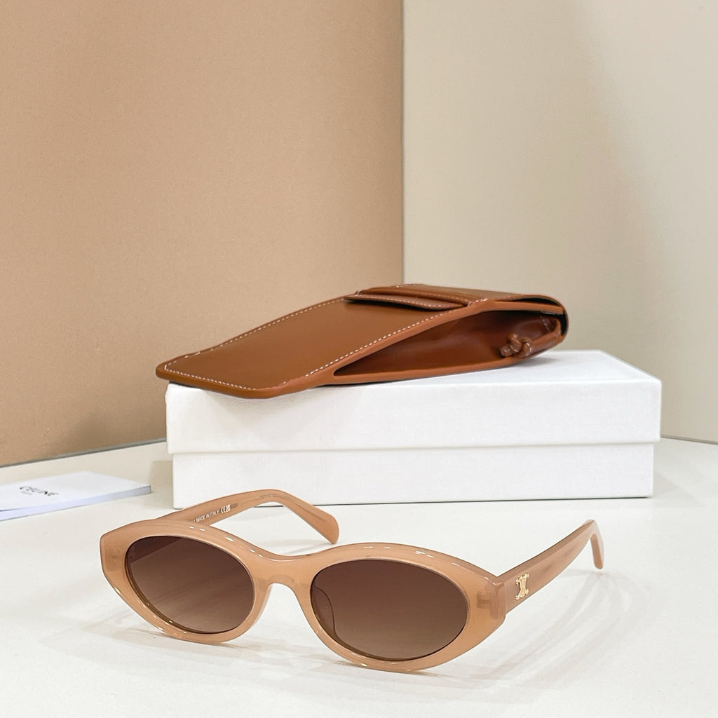 Celine sunglasses with tan frames and brown tinted lenses, side view.