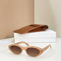 Celine sunglasses with tan frames and brown tinted lenses, side view.