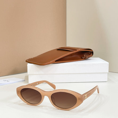 Celine sunglasses with tan frames and brown tinted lenses, side view.