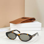 Celine sunglasses with tortoiseshell frames and dark lenses, side view.
