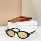 Celine sunglasses with black frames and light lenses, angled view.