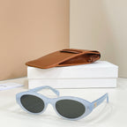 Celine sunglasses with light blue frames and dark lenses, side view.