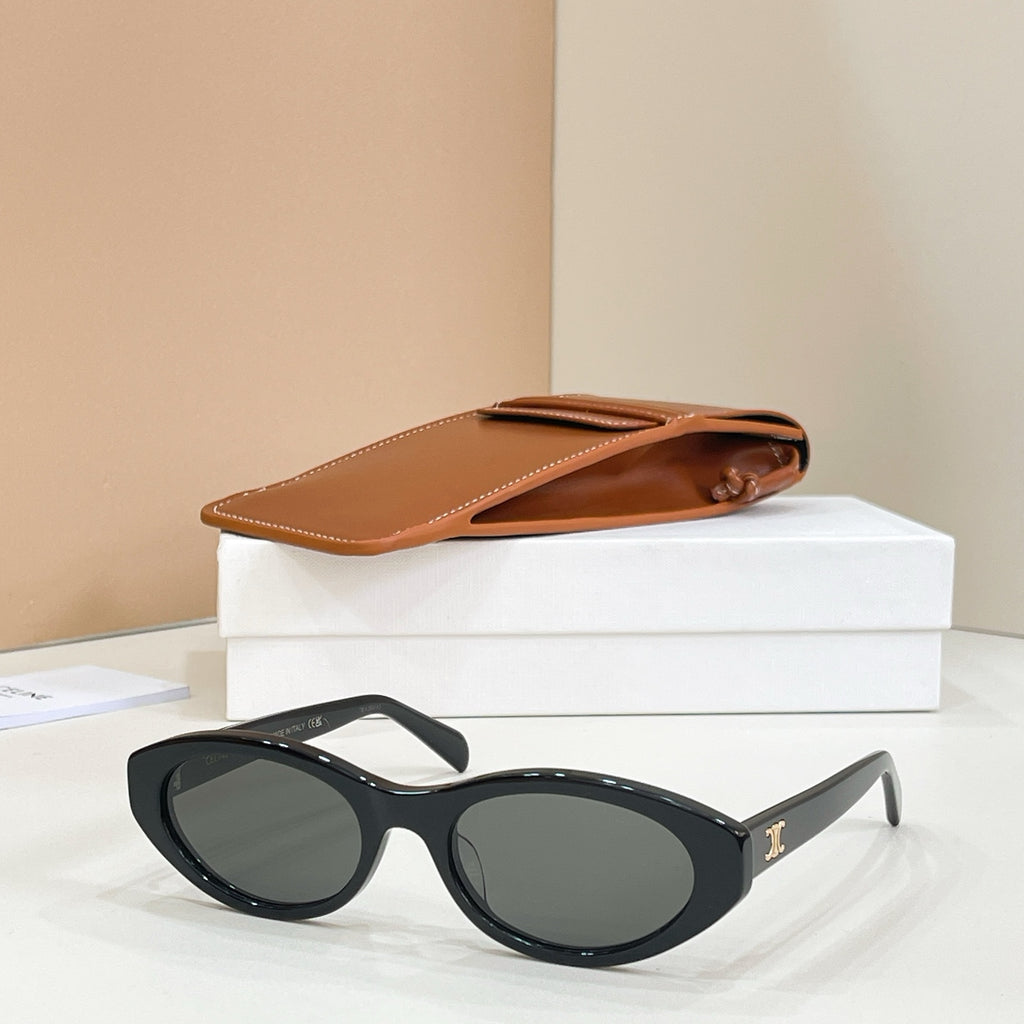 Dark rounded full-rim eyeglasses with a glossy finish