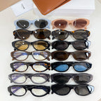 Assorted eyeglasses in multiple colors with oval lenses on display
