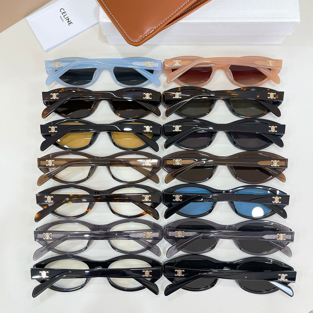 Assorted eyeglasses with oval frames in black, brown, and blue tones