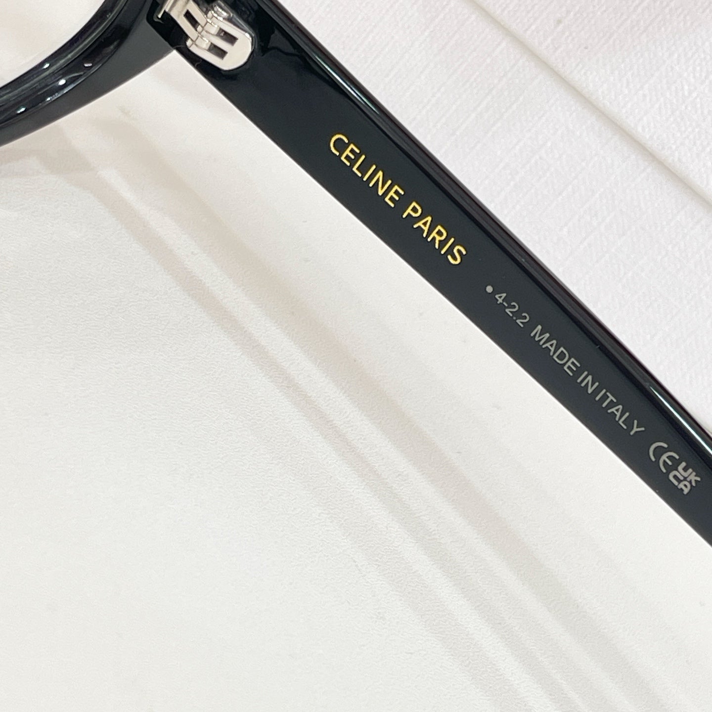 Black eyeglass arm with CELINE PARIS and MADE IN ITALY text