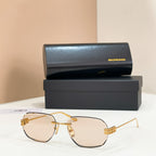 Balenciaga sunglasses with light beige tinted lenses and gold metal frame