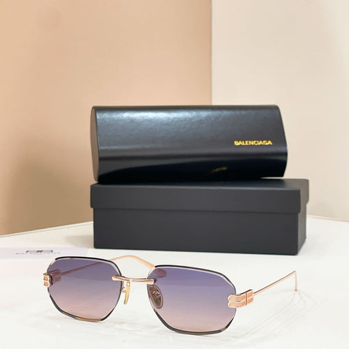 Balenciaga sunglasses with purple tinted lenses and gold metal frame