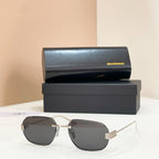 Balenciaga sunglasses with dark lenses and gold metal frame