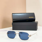 Balenciaga sunglasses with blue tinted lenses and gold metal frame