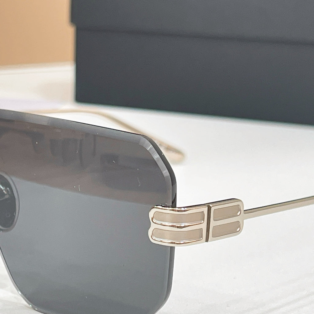 Sunglasses close-up: metal temple hinge and dark lens