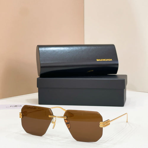 Sunglasses with amber lenses and gold metal frame, front view