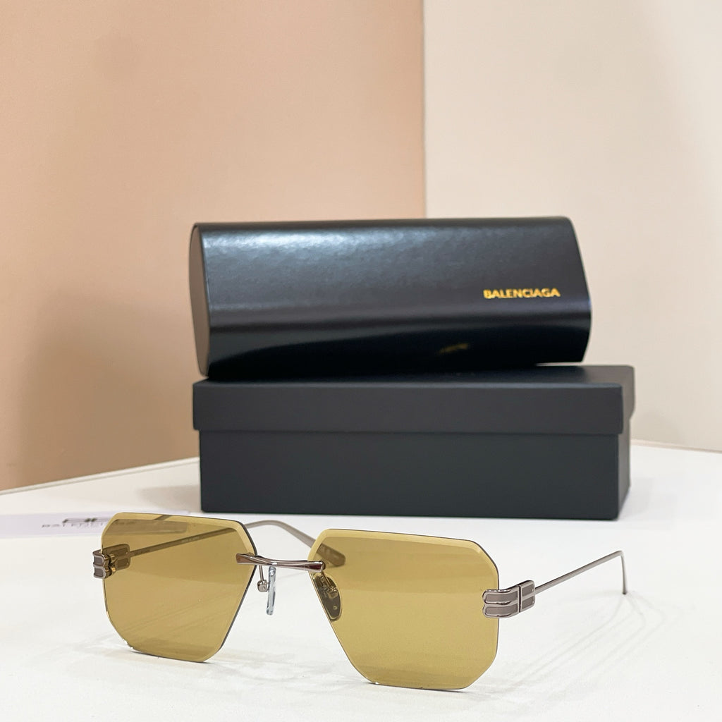 Sunglasses with yellow lenses and gold metal frame, front view