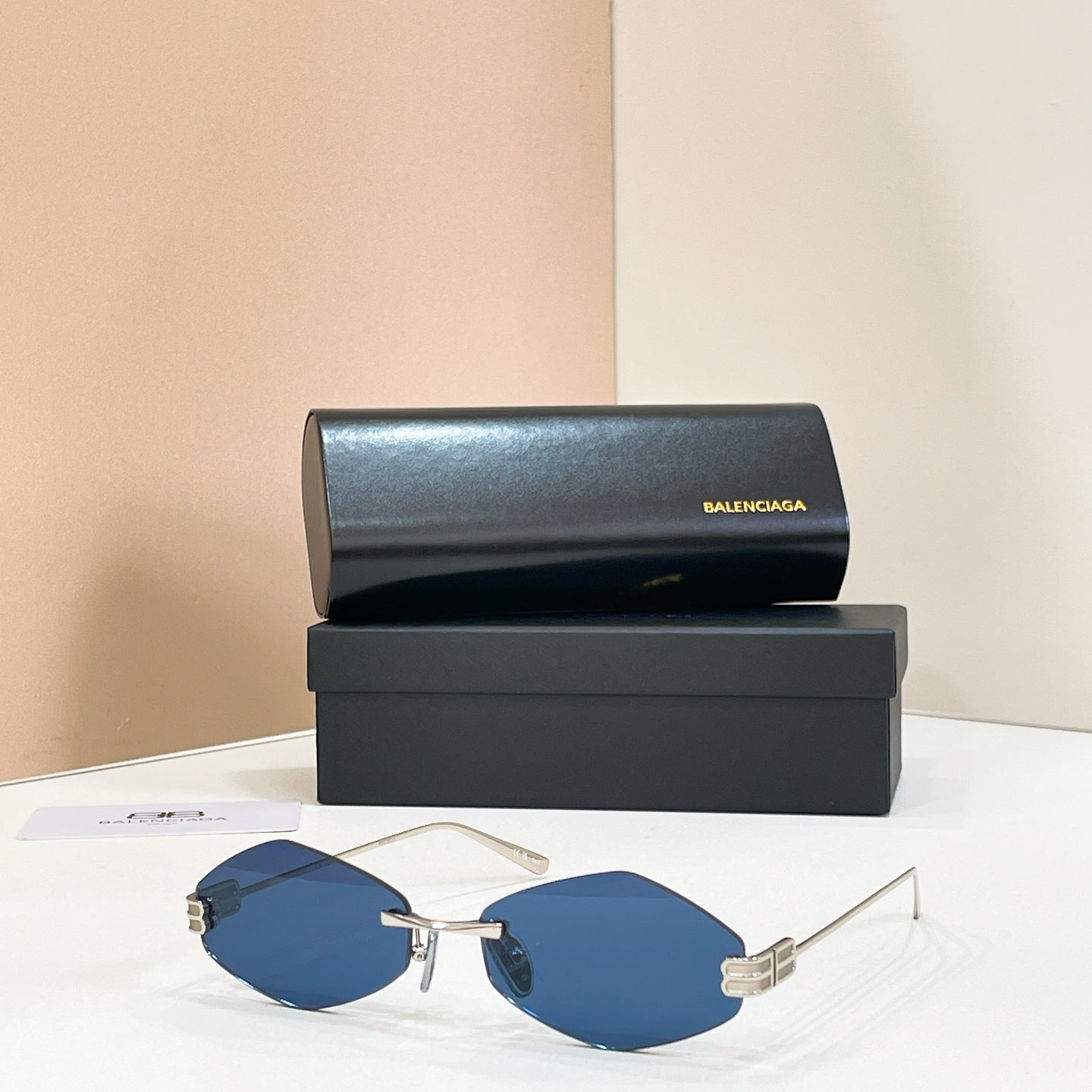 Sunglasses with gold-tone metal frame and blue mirrored lenses