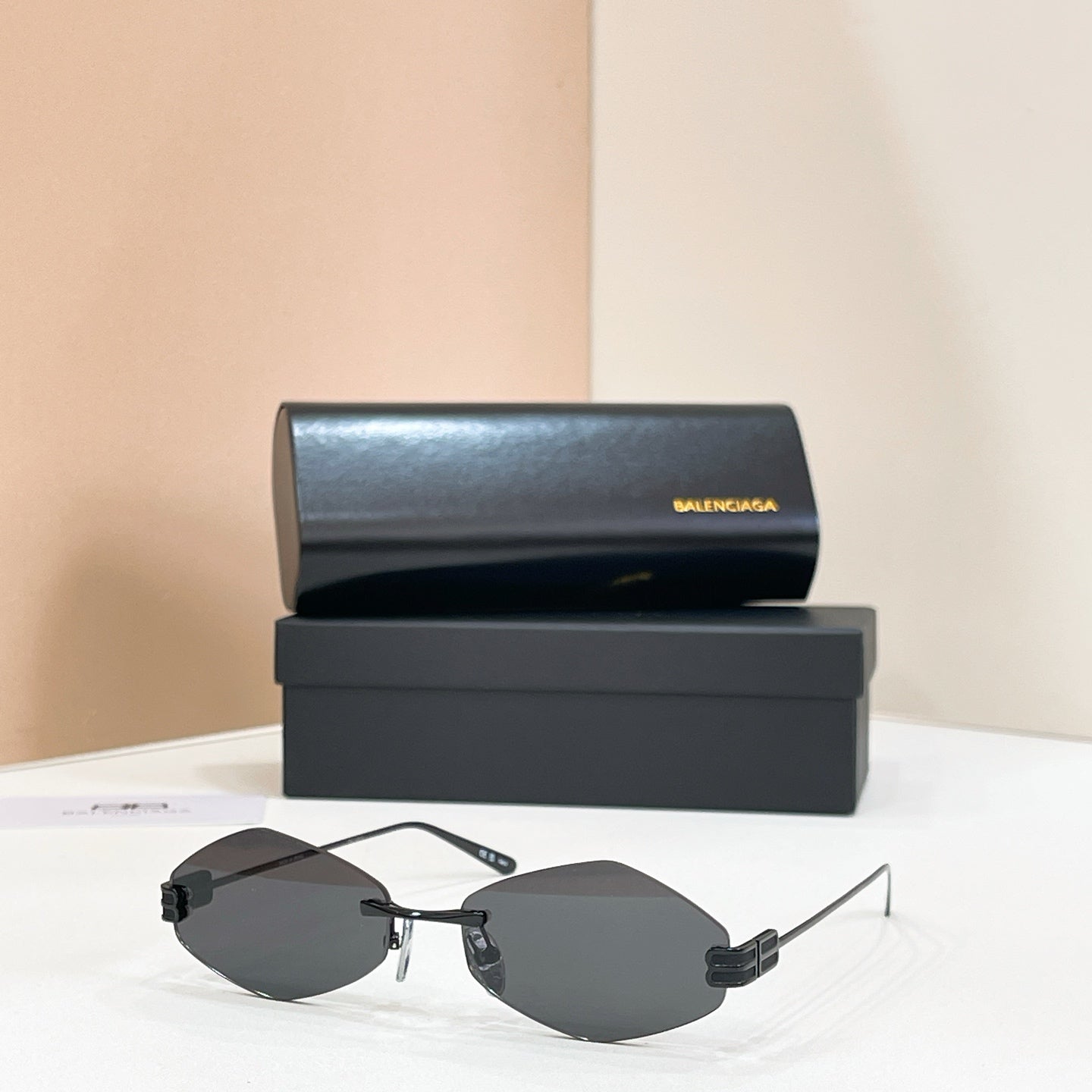 Sunglasses with gold-tone metal frame and dark lenses