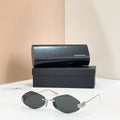 Balenciaga round sunglasses with gold-tone metal frame and dark smoke lenses