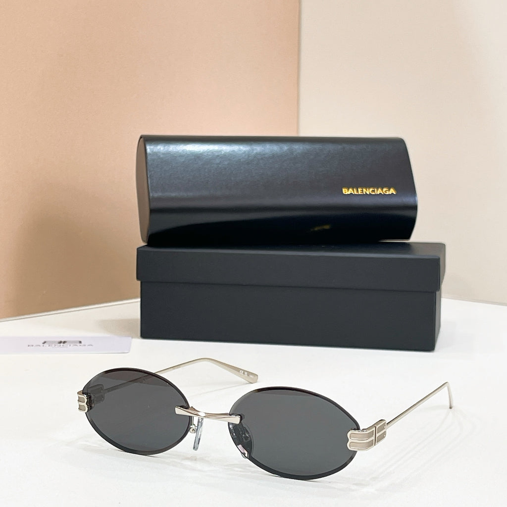 Gold round sunglasses with dark lenses and clear temples