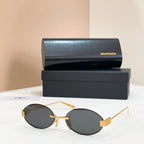 Gold round sunglasses with dark lenses and thin metal bridge detail