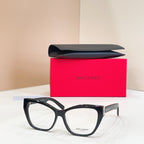 Eyeglasses with black frames, clear lenses, and gold logo detail at temple