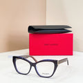 Eyeglasses with dark blue-black frames, clear lenses, and gold logo detail at temple
