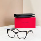 Eyeglasses with black frames, clear lenses, and gold logo detail at temple