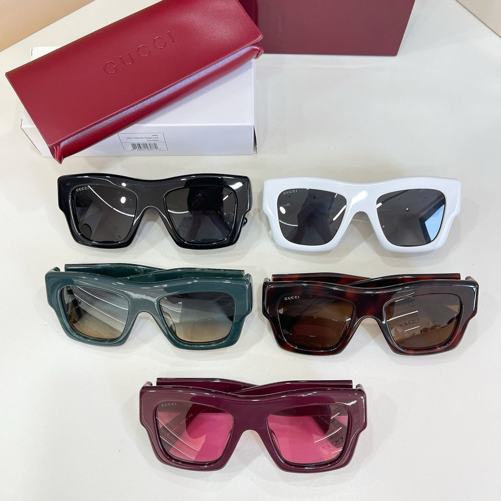 Gucci glasses set of five pairs: white, black, green, tortoiseshell, and burgundy frames.