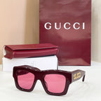 Gucci glasses with burgundy square frames and pink tinted lenses, gold logo on temple.
