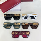 Gucci glasses set of five pairs in black, white, green, tortoiseshell, and burgundy.