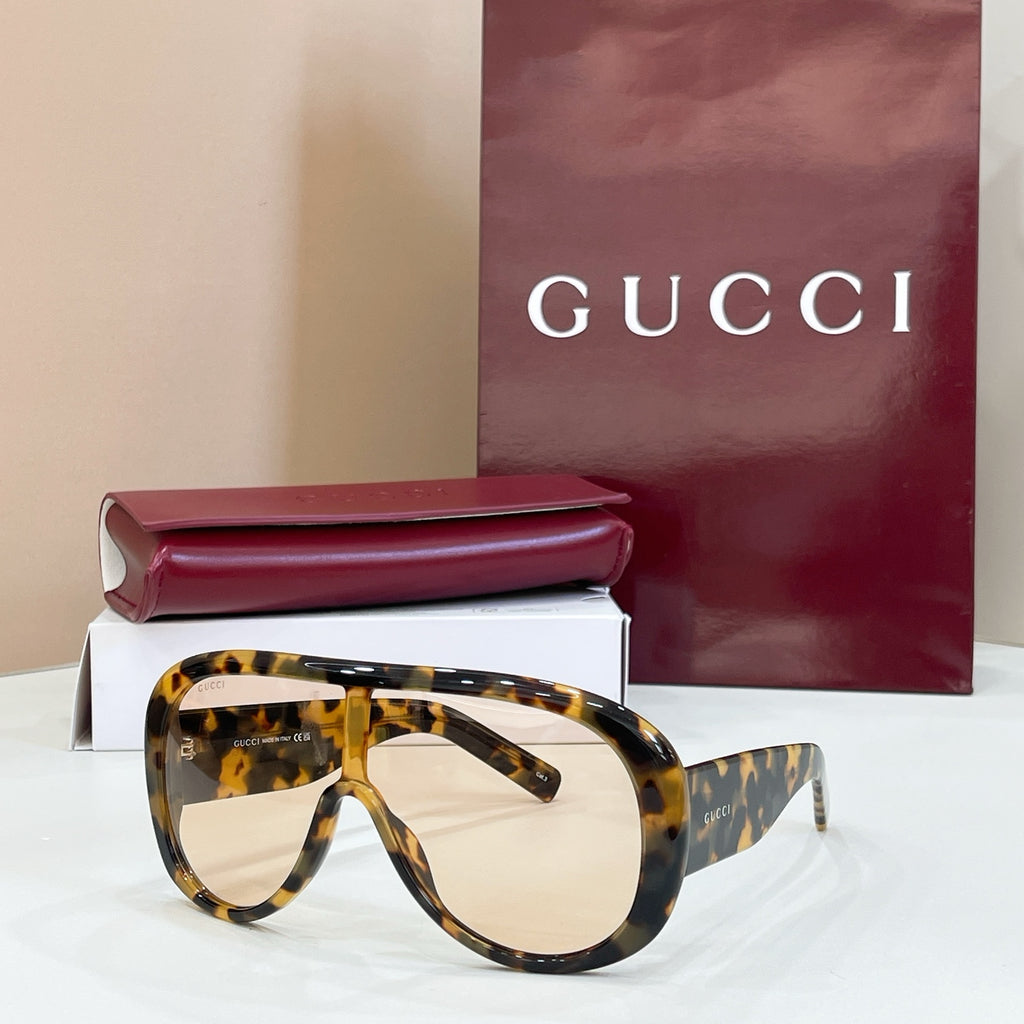 Gucci oversized tortoiseshell sunglasses with light beige lenses and dark temples