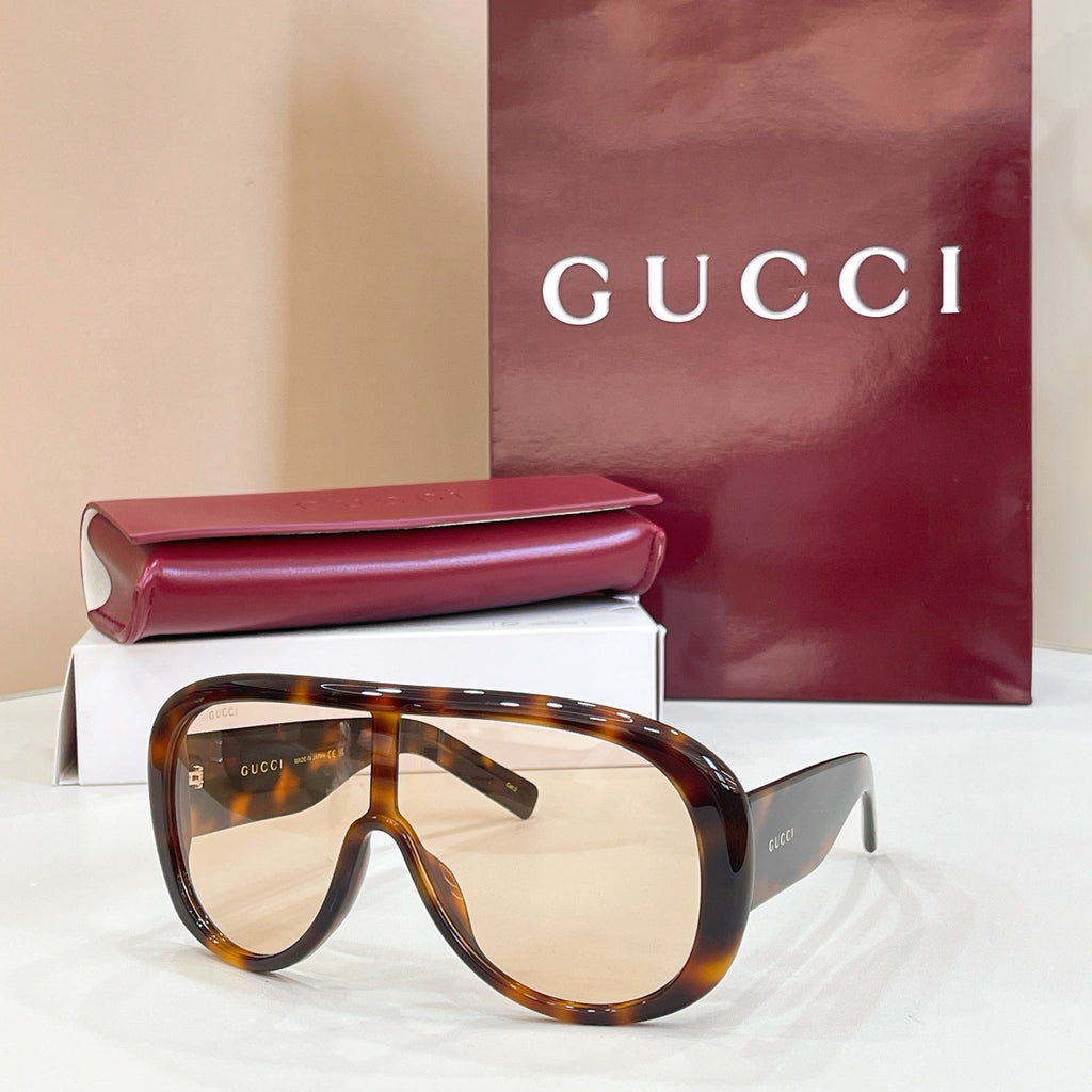 Gucci oversized tortoiseshell sunglasses with warm brown lenses and dark temples