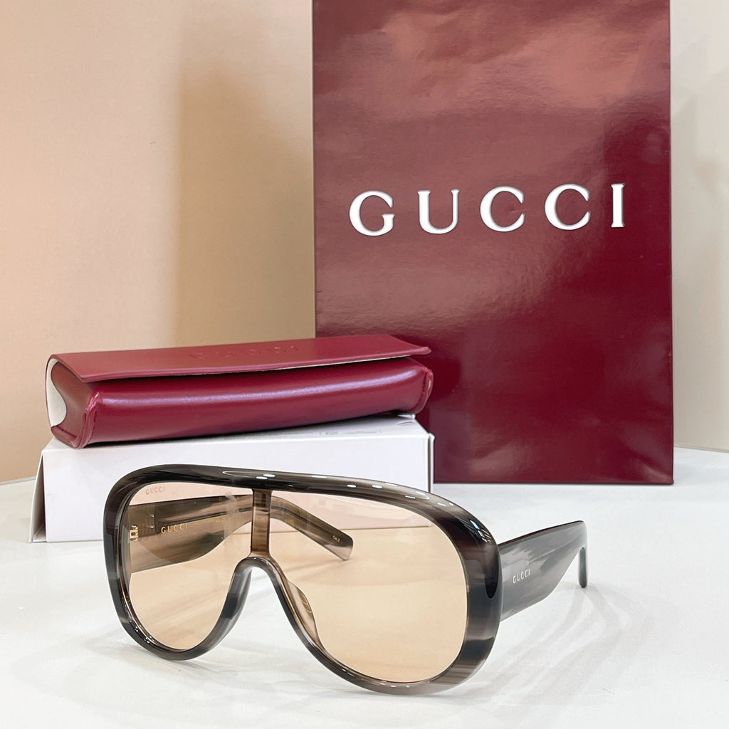 Gucci oversized dark tortoiseshell sunglasses with light beige lenses and angled temples