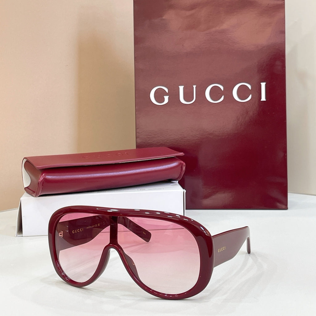 Burgundy sunglasses with tinted lenses and oversized full-rim frame