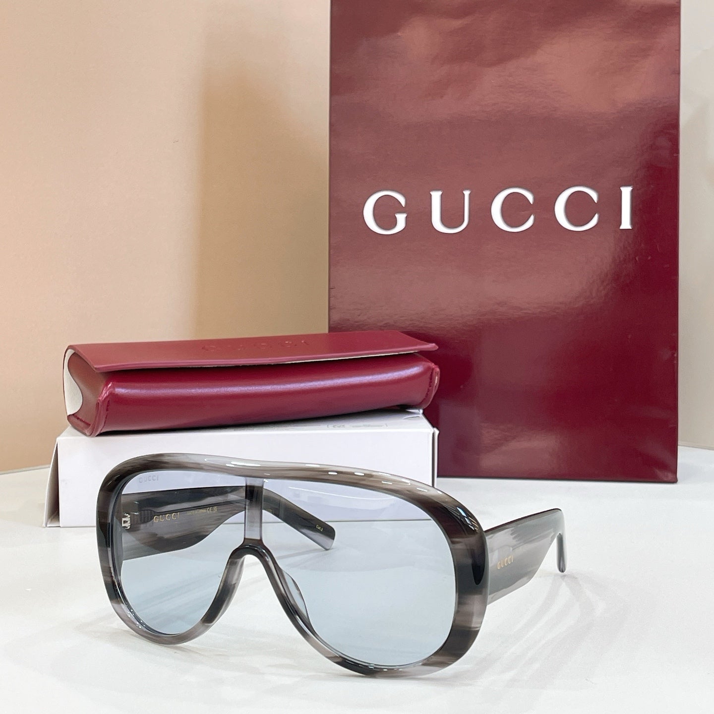 Dark tortoiseshell sunglasses with clear lenses and curved full-rim frame