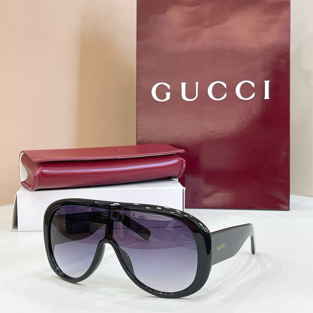 Black sunglasses with oversized angular lenses and full-rim frame
