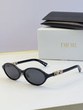 Dior round eyeglasses with black frame, dark lenses, and gold logo temples