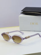 Dior round eyeglasses with light purple frame, beige lenses, and gold logo
