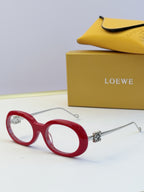 Red round sunglasses with gold-tone hinges and tinted lenses