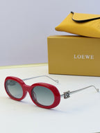 Red round sunglasses with gold-tone hinges and tinted lenses